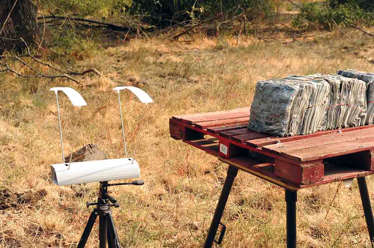 A chronograph is placed in front of wet newspapers to record velocity just prior to bullet impact.